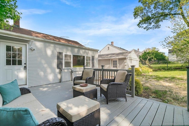 wooden deck featuring fence and an outdoor living space