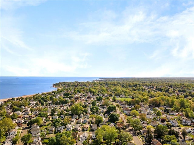 aerial view of residential area with a large body of water