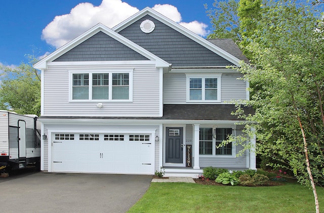 229 Long Hill Cross Rd, Shelton, CT 06484 - view of front of house featuring an attached garage, driveway, a front yard, and a shingled roof