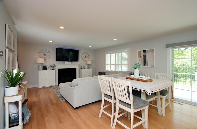 229 Long Hill Cross Rd, Shelton, CT 06484 - dining space with light wood-style floors, recessed lighting, and a fireplace