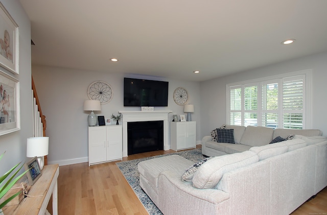 229 Long Hill Cross Rd, Shelton, CT 06484 - living room with recessed lighting, a fireplace, light wood-style floors, and baseboards