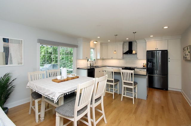 229 Long Hill Cross Rd, Shelton, CT 06484 - dining room with light wood finished floors, baseboards, and recessed lighting