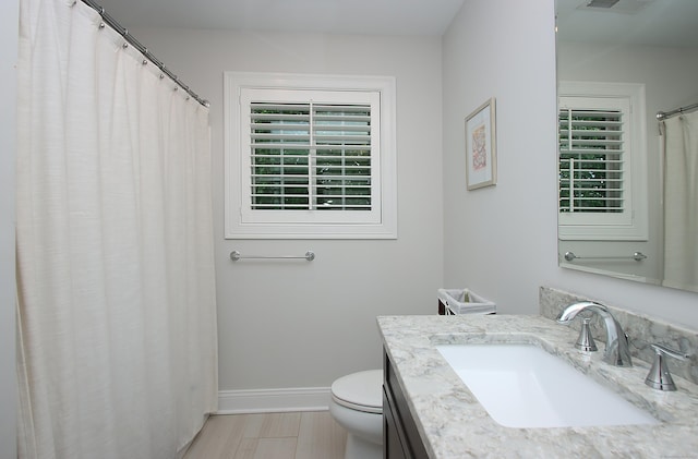 229 Long Hill Cross Rd, Shelton, CT 06484 - bathroom with vanity, baseboards, and toilet