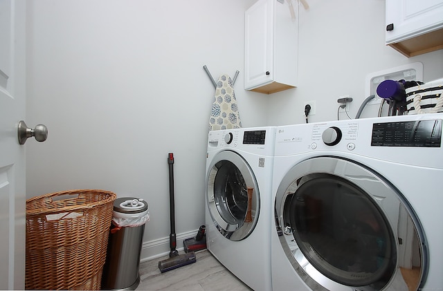 229 Long Hill Cross Rd, Shelton, CT 06484 - laundry room with cabinet space, washer and clothes dryer, and baseboards