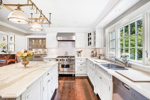 1191 Oenoke Rdg, New Canaan, CT 06840 - kitchen featuring appliances with stainless steel finishes, wall chimney exhaust hood, dark wood finished floors, white cabinets, and crown molding