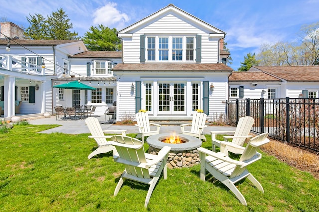 1191 Oenoke Rdg, New Canaan, CT 06840 - rear view of property with a fire pit, french doors, and a patio