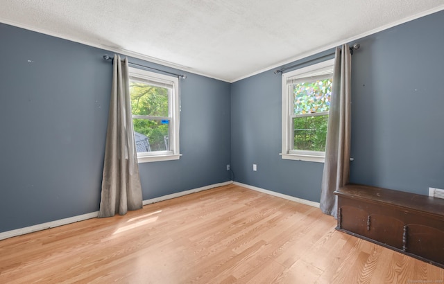 2517 Main St, Coventry, CT 06238 - unfurnished room featuring crown molding, wood finished floors, a textured ceiling, and baseboards
