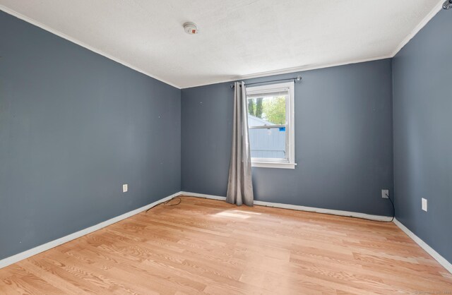 2517 Main St, Coventry, CT 06238 - spare room featuring light wood-style flooring, crown molding, and baseboards