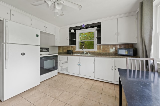 2517 Main St, Coventry, CT 06238 - kitchen with freestanding refrigerator, range with electric cooktop, open shelves, a sink, and black microwave