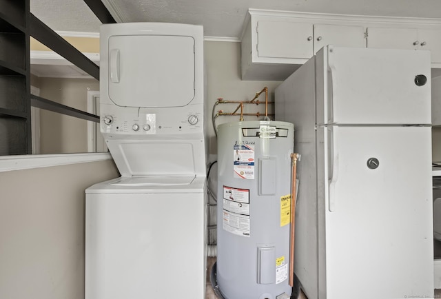 2517 Main St, Coventry, CT 06238 - laundry area featuring stacked washer / dryer, water heater, and cabinet space