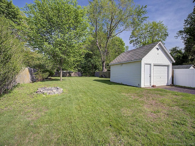283 Quinnipiac Ave, North Haven, CT 06473 - view of yard featuring an outdoor structure, a detached garage, and driveway