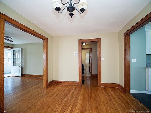 283 Quinnipiac Ave, North Haven, CT 06473 - unfurnished room with a chandelier, wood finished floors, and baseboards