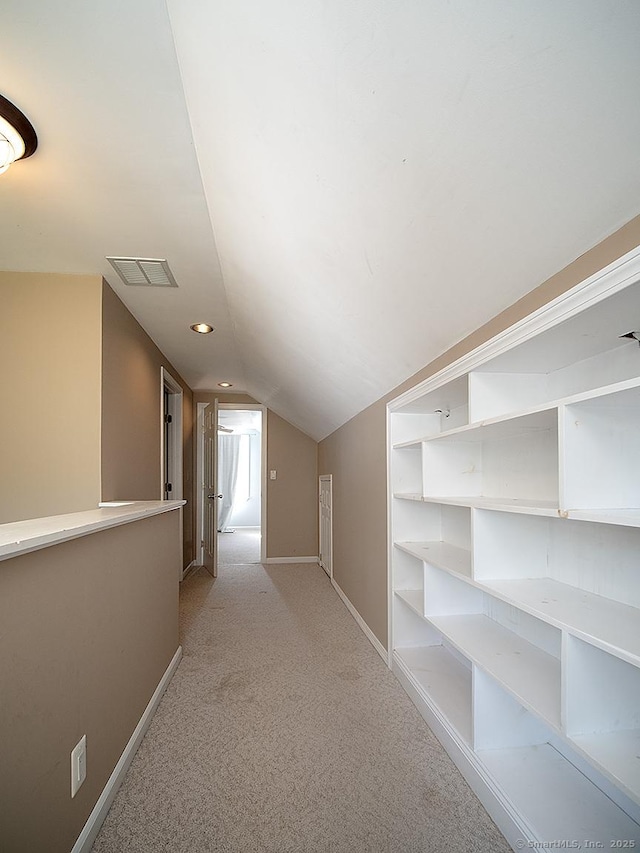 283 Quinnipiac Ave, North Haven, CT 06473 - corridor featuring baseboards, light carpet, vaulted ceiling, and recessed lighting