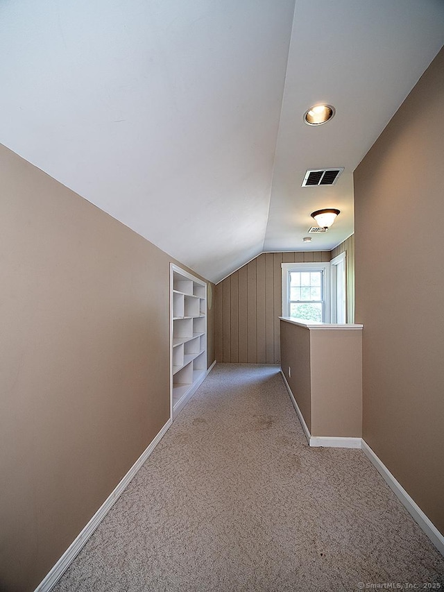 283 Quinnipiac Ave, North Haven, CT 06473 - bonus room with baseboards, lofted ceiling, and light colored carpet