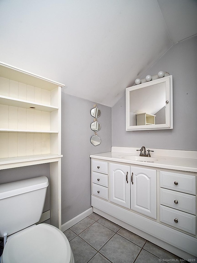 283 Quinnipiac Ave, North Haven, CT 06473 - bathroom featuring lofted ceiling, tile patterned flooring, toilet, vanity, and baseboards