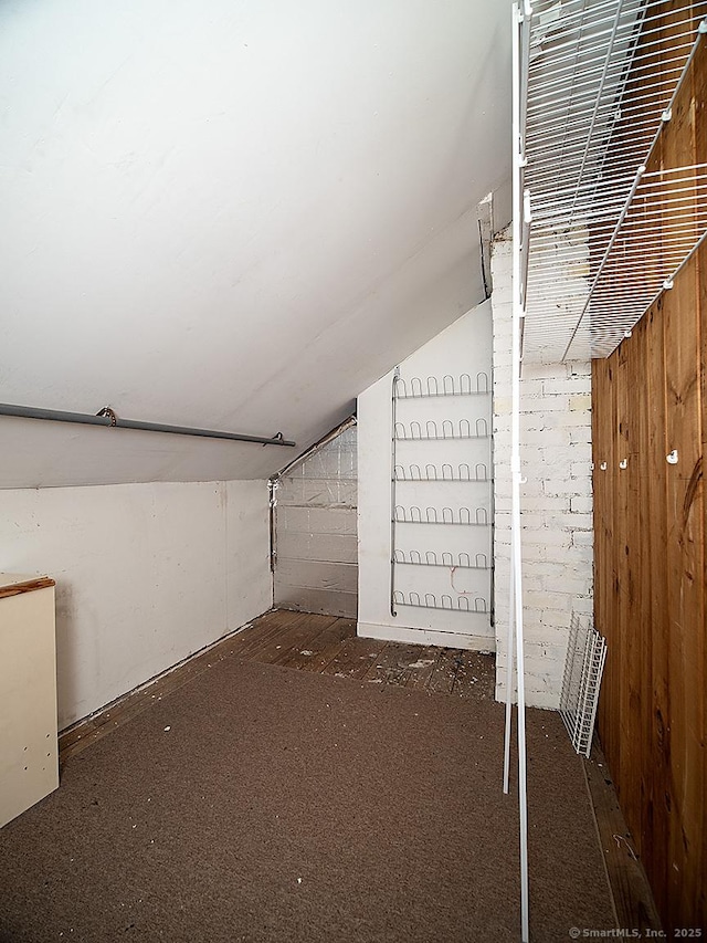 283 Quinnipiac Ave, North Haven, CT 06473 - additional living space with carpet, vaulted ceiling, and wooden walls