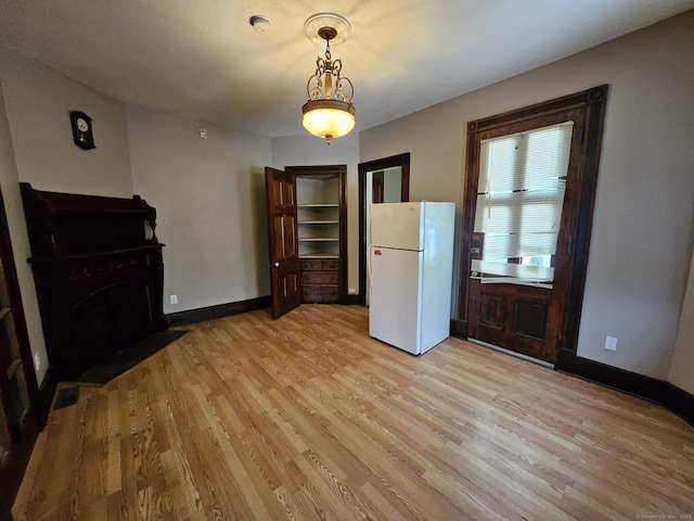 36 Bellevue Ave, Bristol, CT 06010 - unfurnished living room with light wood finished floors and baseboards
