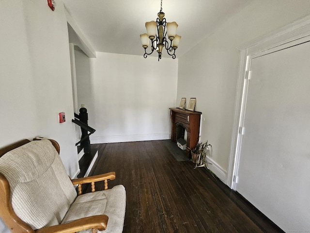 36 Bellevue Ave, Bristol, CT 06010 - living area with a chandelier, wood-type flooring, and baseboards