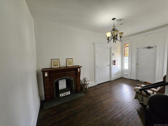 36 Bellevue Ave, Bristol, CT 06010 - entryway featuring a chandelier, dark wood finished floors, baseboards, and a fireplace