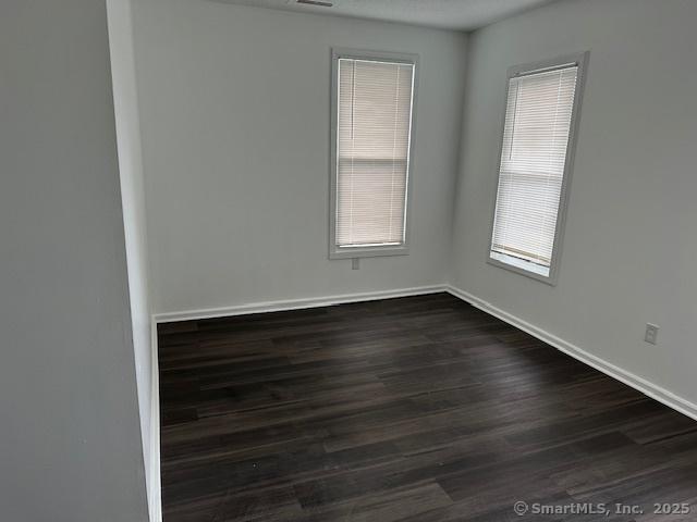 36 Bellevue Ave, Bristol, CT 06010 - unfurnished room featuring dark wood-style flooring and baseboards