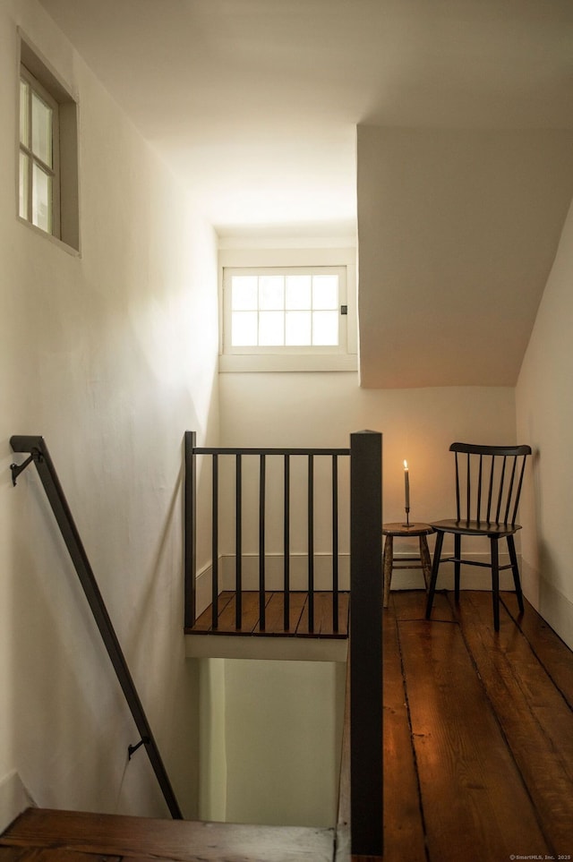 stairs featuring wood-type flooring and baseboards
