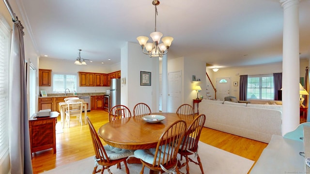 94 E Ridge Rd, Middletown, CT 06457 - dining space with a chandelier, ornate columns, stairway, light wood-type flooring, and recessed lighting