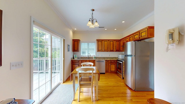 94 E Ridge Rd, Middletown, CT 06457 - kitchen with stainless steel appliances, crown molding, a chandelier, plenty of natural light, and a sink