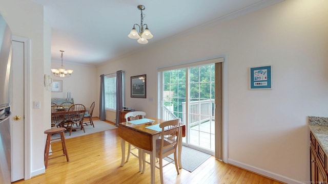 94 E Ridge Rd, Middletown, CT 06457 - dining room with a chandelier, light wood-style flooring, crown molding, and baseboards