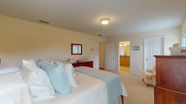 94 E Ridge Rd, Middletown, CT 06457 - bedroom featuring light colored carpet, baseboards, a sink, and ensuite bath
