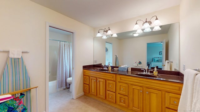 94 E Ridge Rd, Middletown, CT 06457 - full bath featuring double vanity, toilet, tile patterned flooring, shower / bath combo, and baseboards