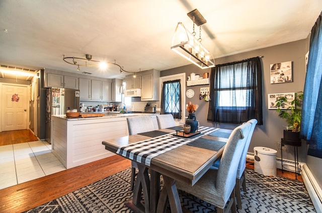 51 Palmetto Trl, East Haven, CT 06512 - dining room with light wood finished floors and baseboard heating