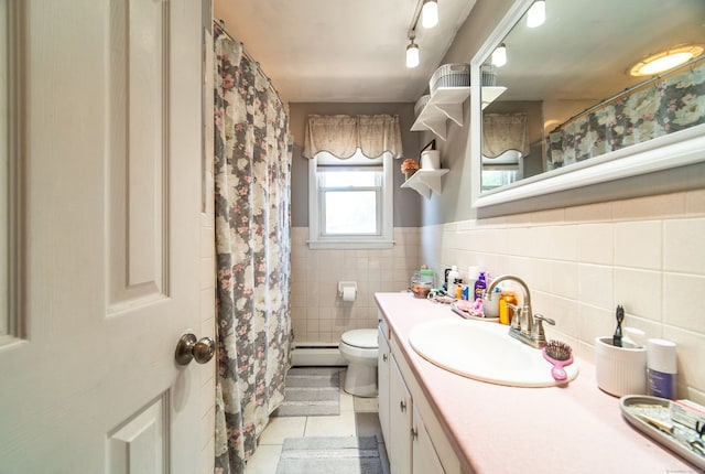 51 Palmetto Trl, East Haven, CT 06512 - full bath with a baseboard heating unit, tile patterned flooring, tile walls, vanity, and toilet