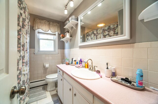 51 Palmetto Trl, East Haven, CT 06512 - full bath featuring baseboard heating, tile walls, vanity, toilet, and tile patterned flooring