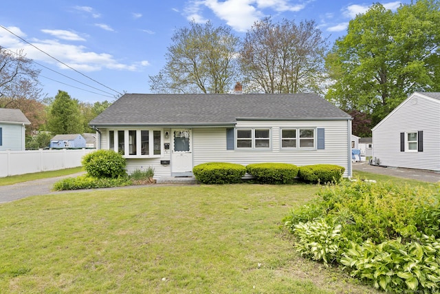 81 Montague Cir E, Hartford, CT 06118 - view of front of house featuring a shingled roof and a chimney