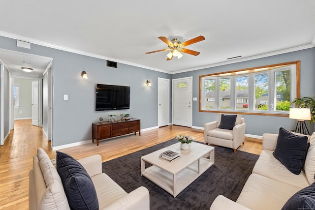 81 Montague Cir E, Hartford, CT 06118 - living area featuring a ceiling fan, light wood-style flooring, crown molding, and baseboards
