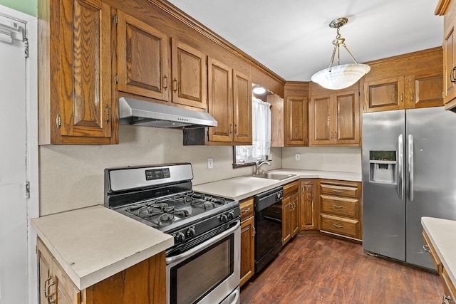 81 Montague Cir E, Hartford, CT 06118 - kitchen featuring appliances with stainless steel finishes, a sink, under cabinet range hood, brown cabinets, and light countertops