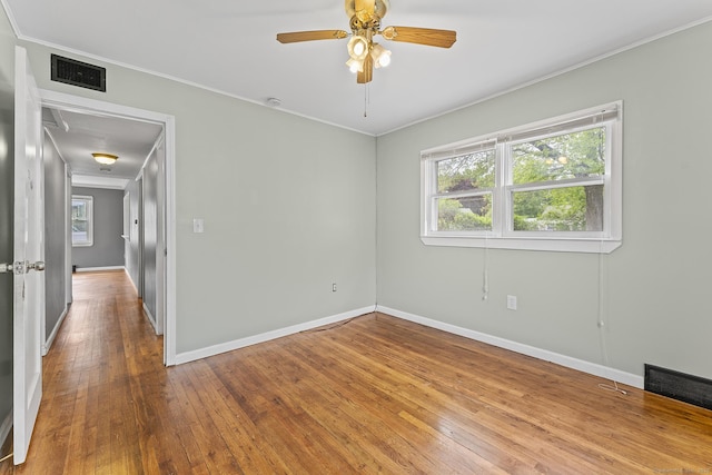 81 Montague Cir E, Hartford, CT 06118 - unfurnished room with plenty of natural light, crown molding, baseboards, wood-type flooring, and ceiling fan