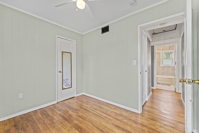81 Montague Cir E, Hartford, CT 06118 - spare room with attic access, light wood finished floors, a smoke detector, ceiling fan, and ornamental molding