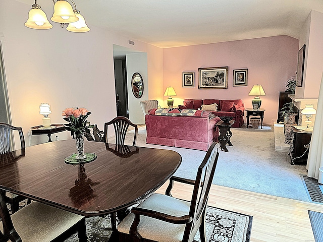 470 Heritage Vlg Unit A, Southbury, CT 06488 - dining space with a chandelier and light wood-style flooring