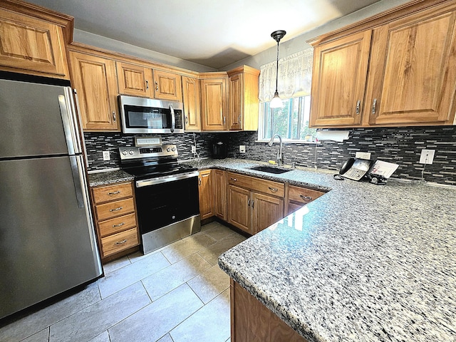 470 Heritage Vlg Unit A, Southbury, CT 06488 - kitchen with stainless steel appliances, a sink, brown cabinetry, and backsplash