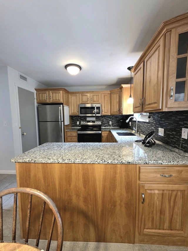 470 Heritage Vlg Unit A, Southbury, CT 06488 - kitchen with stainless steel appliances, tasteful backsplash, a sink, and light stone counters