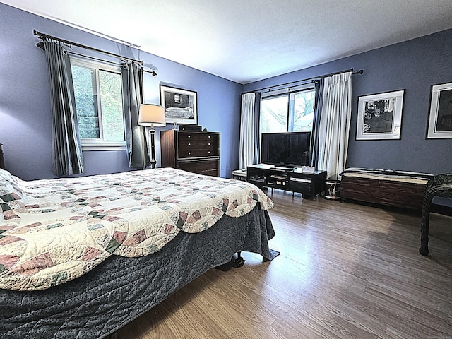 470 Heritage Vlg Unit A, Southbury, CT 06488 - bedroom with multiple windows and wood finished floors