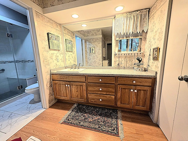 470 Heritage Vlg Unit A, Southbury, CT 06488 - full bath with wallpapered walls, toilet, a shower stall, vanity, and recessed lighting