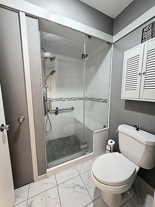 470 Heritage Vlg Unit A, Southbury, CT 06488 - bathroom with marble finish flooring, toilet, a stall shower, and baseboards