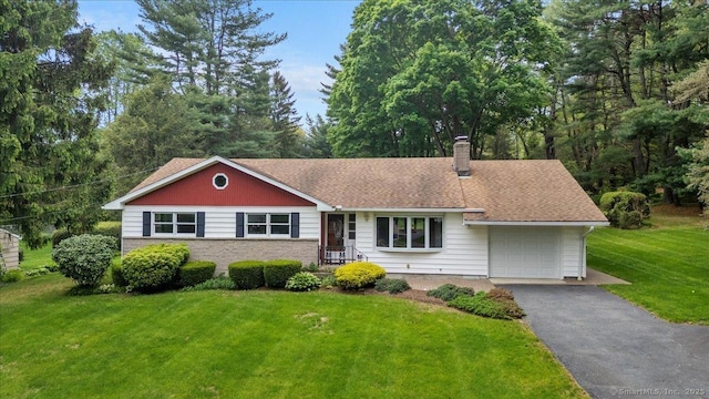 120 Peters Ln, Stratford, CT 06614 - ranch-style home with a chimney, a front yard, an attached garage, and driveway