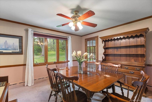 120 Peters Ln, Stratford, CT 06614 - dining room featuring a ceiling fan, light carpet, crown molding, and wallpapered walls