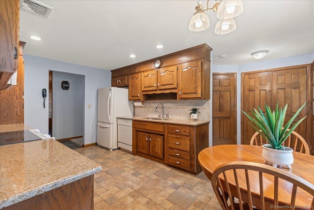 120 Peters Ln, Stratford, CT 06614 - kitchen with white appliances, a sink, backsplash, stone tile flooring, and recessed lighting