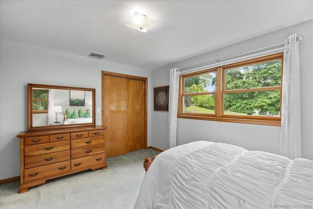 120 Peters Ln, Stratford, CT 06614 - bedroom featuring light carpet, baseboards, and a closet