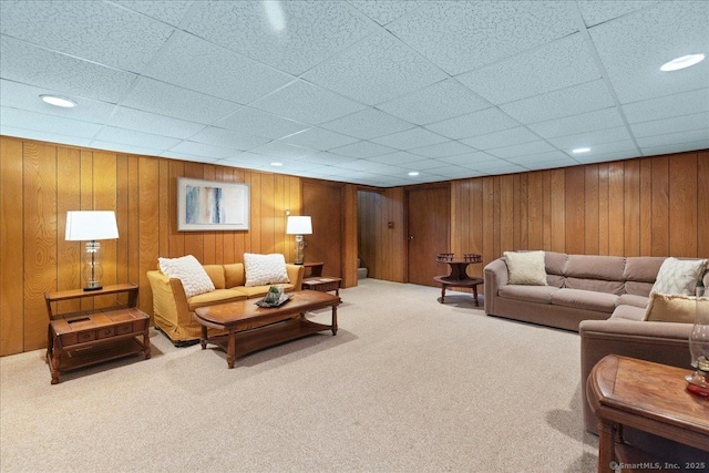 120 Peters Ln, Stratford, CT 06614 - carpeted living room with a drop ceiling, recessed lighting, and wooden walls