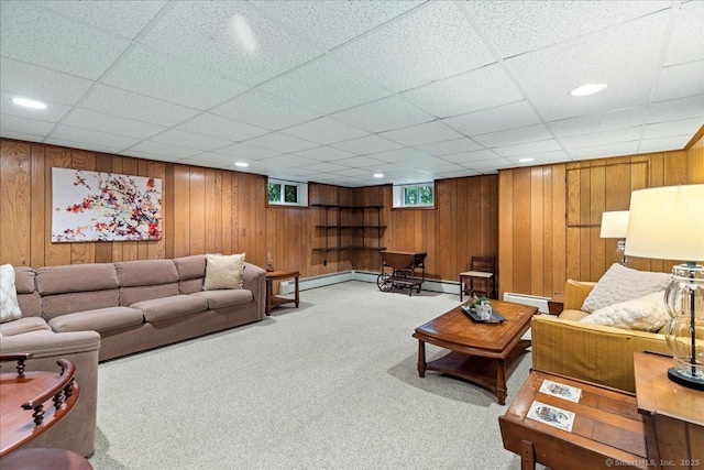 120 Peters Ln, Stratford, CT 06614 - carpeted living area with baseboard heating, wooden walls, a drop ceiling, and recessed lighting